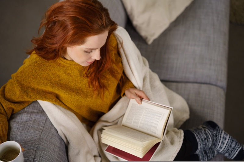 Redhead Woman Reading Book Couch Blanket