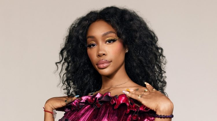 Flaunting some shoulder, SZA poses in Alexandre Vauthier jumpsuit.