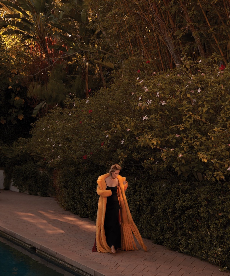 Actress Sarah Paulson walks in Bottega Veneta coat and Max Mara dress.