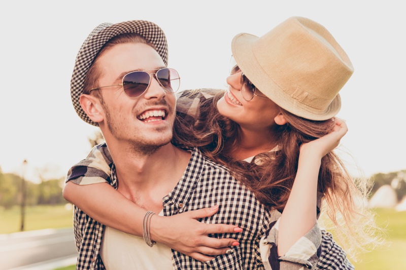 Smiling Couple Hats Sunglasses Outdoors