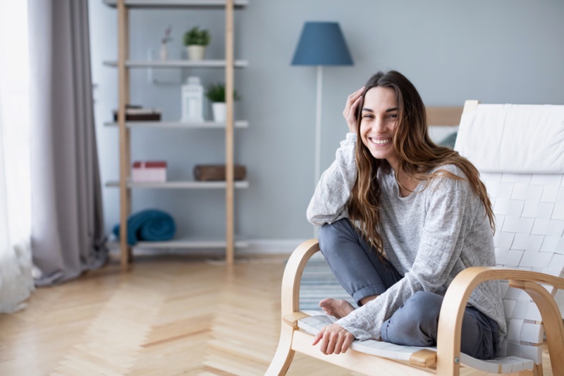 Smiling Woman Sitting Home