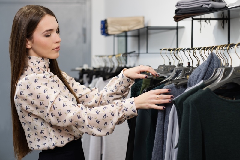 Woman Browsing Clothing Rack Printed Shirt