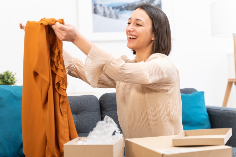 Woman Opening Clothes Box