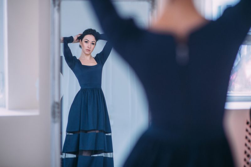 Woman Trying on Dress at Home