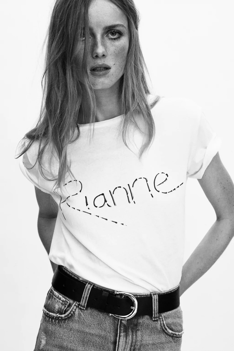 Rianne van Rompaey poses in Zara basic asymmetric t-shirt and buckle belt.