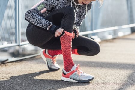 What You Didn't Know About Compression Socks Activewear Female Runner Pulling Pink Socks Sneakers