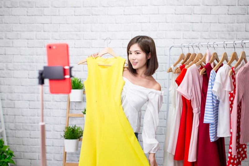 Asian Woman Posing Yellow Dress Clothes Hangers