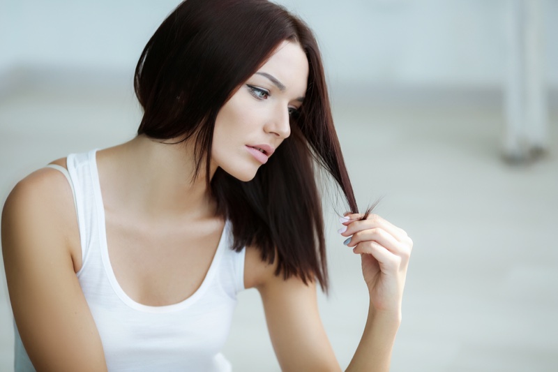 Attractive Woman Looking Hair Unhappy