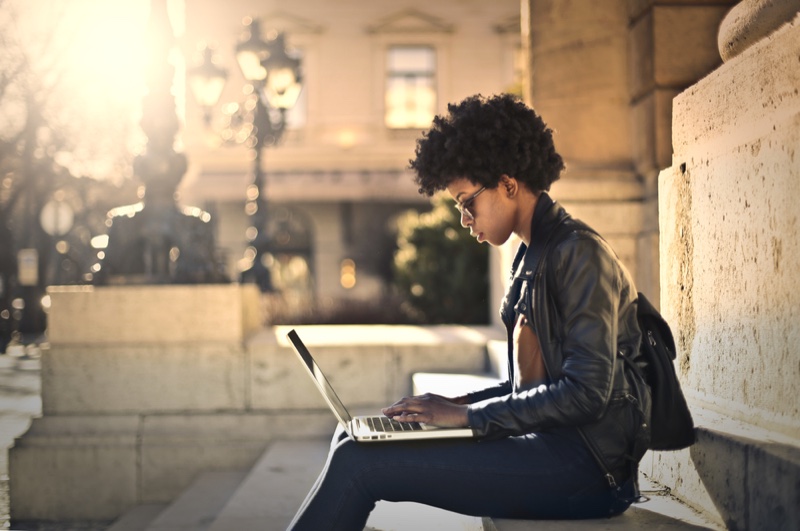 Black Woman Afro Hair Writing Laptop