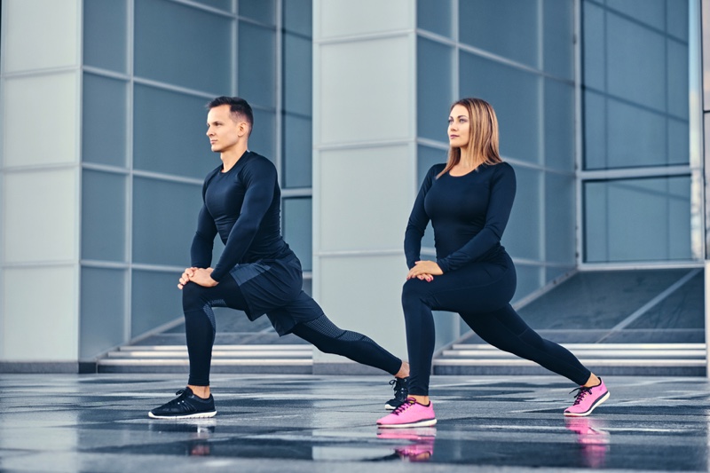 Fitness Model Couple Lunges Workout Clothes