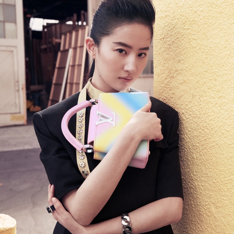 Liu Yifei poses with Louis Vuitton Capucines mini bag in rainbow gradient.