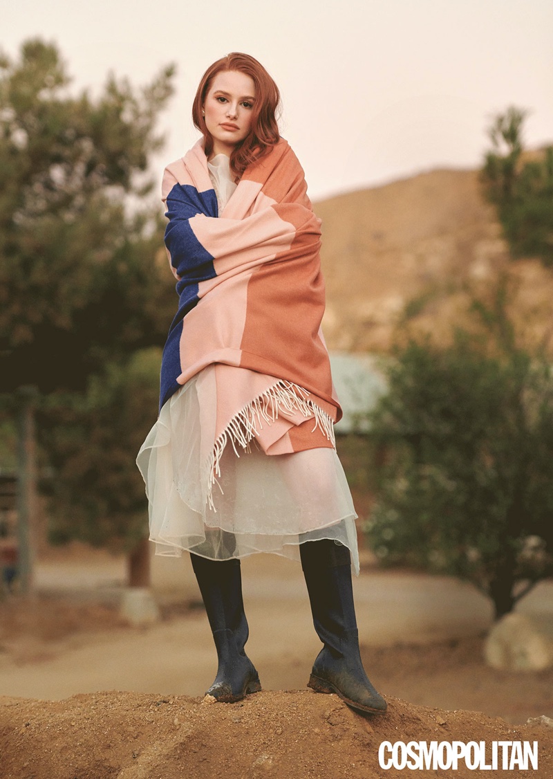 Actress Madelaine Petsch wears Sandy Ling dress with Calle Del Mar Bottoms and La Chameau boots.