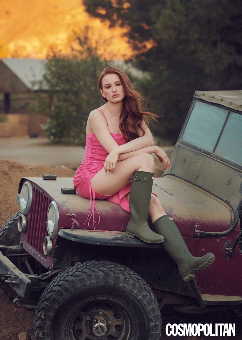 Looking pretty in pink, Madelaine Petsch poses in Prabal Gurung dress and Hunter boots.