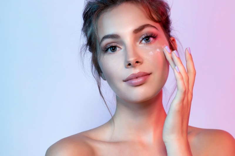 Model Applying Cream Face Beauty