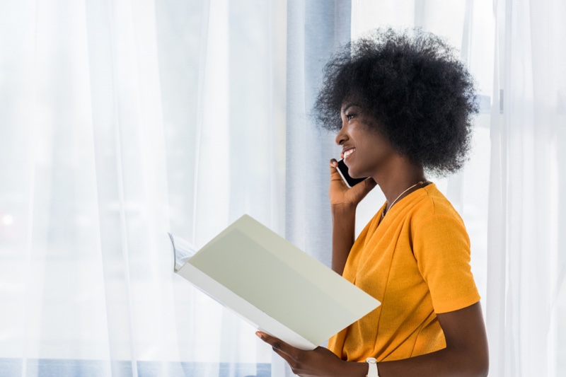 Smiling African American Woman Phone Folder Yellow Top