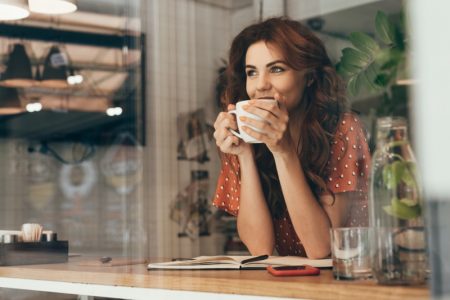 Daily Dosage of Coffee According to Different Experts Woman Drinking Cup Coffee Tea Window Polka Dot Top