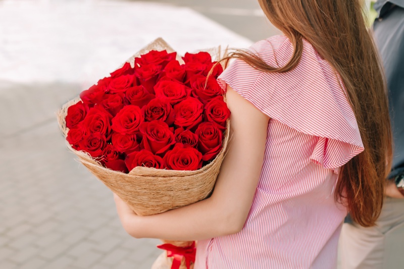 Woman Holding Bouquet Red Roses