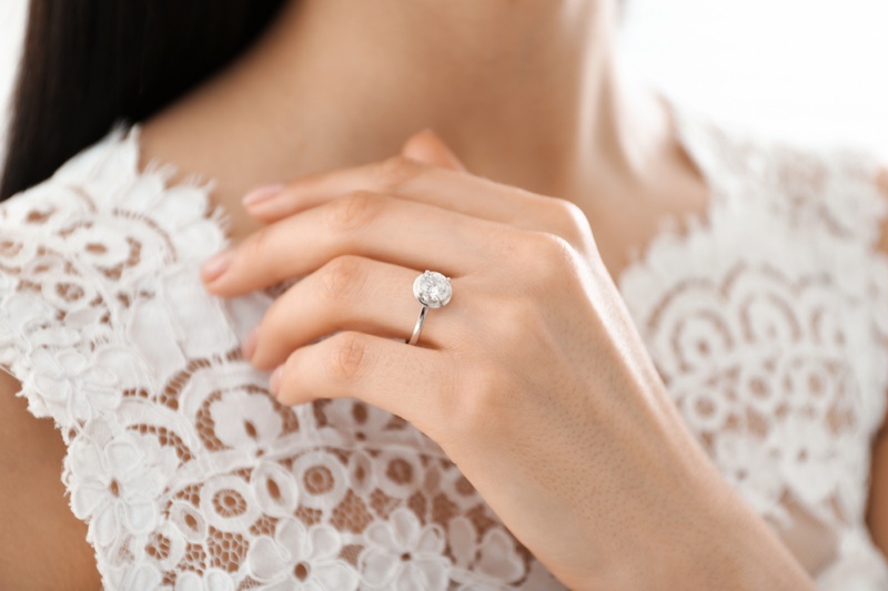 Woman Wearing Diamond Engagement Ring Lace Top