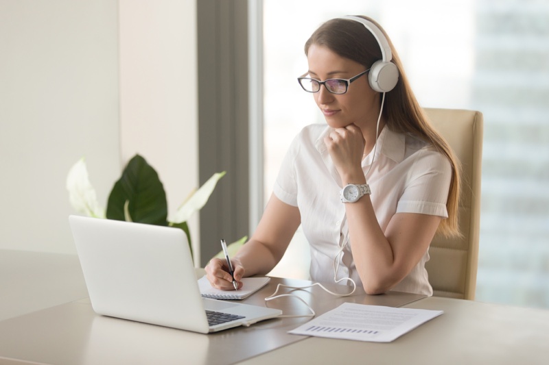 Woman Writing Laptop Headphones Learning Desk