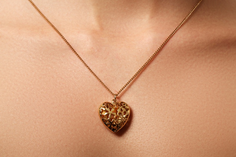 Closeup Gold Engraved Locket Necklace