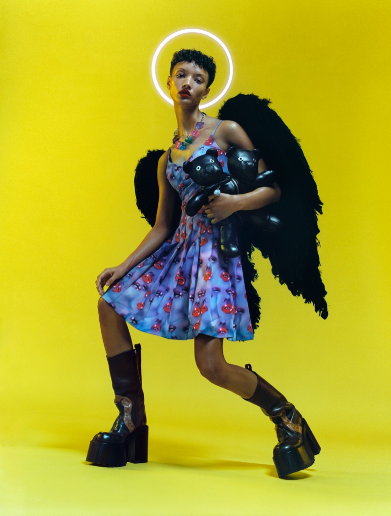 Wearing wings, Georgia Palmer poses for HEAVEN by Marc Jacobs spring-summer 2021 campaign.