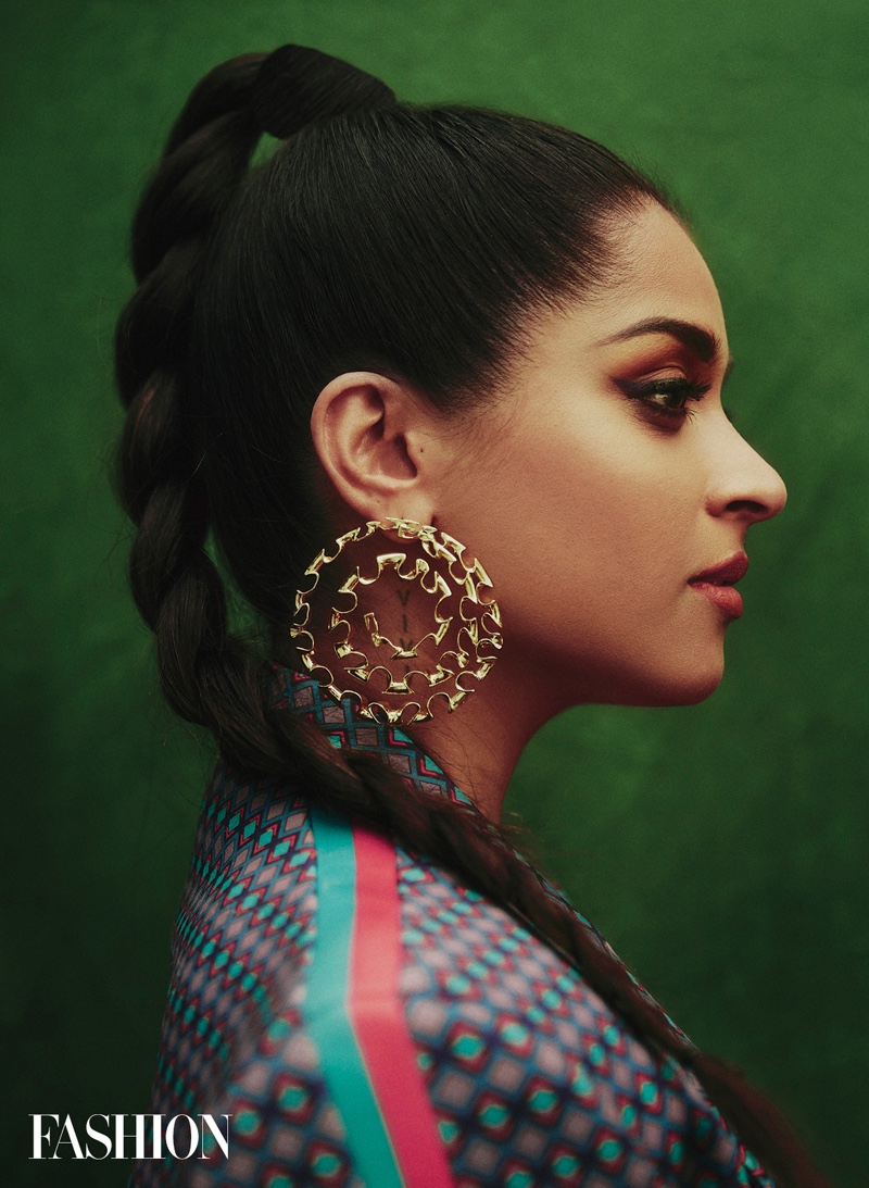 Showing off her side profile, Lily Singh wears Falguni Shane Peacock pantsuit with Misho earrings. Photo: Austin Hargrave / FASHION