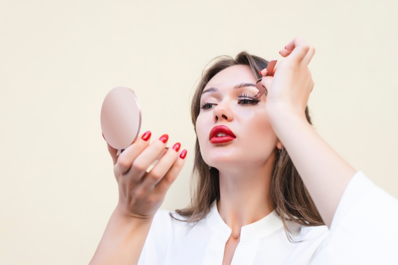 Model Applying Magnetic Eyelashes Beauty Makeup