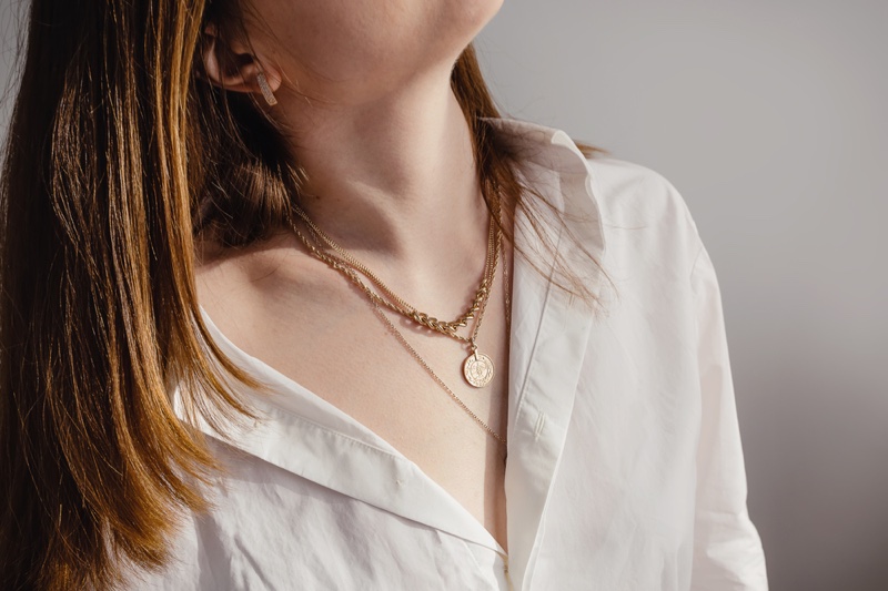 Model Wearing Layered Necklaces Gold Chain Medallion