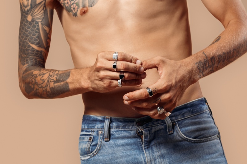 Shirtless Man Tattoos Rings Fingers