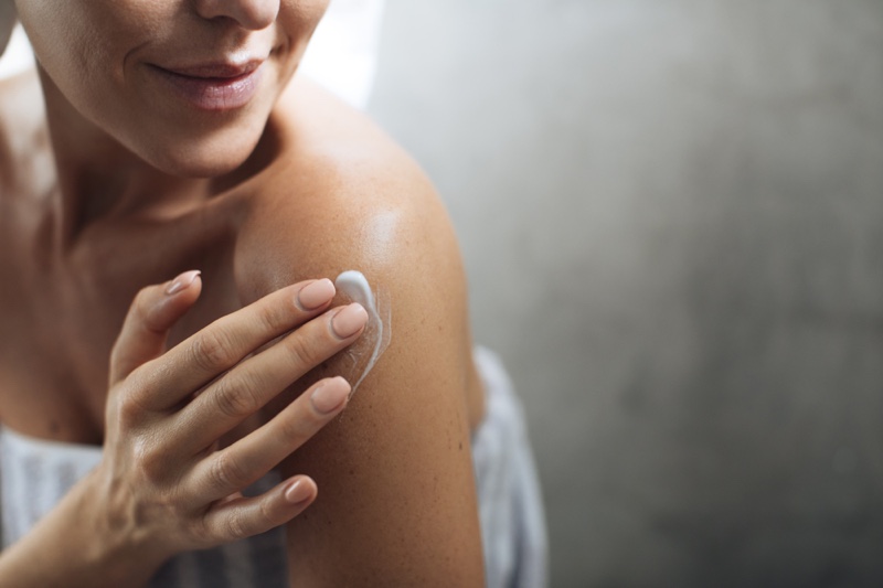 Woman Applying Lotion Cream Shoulder