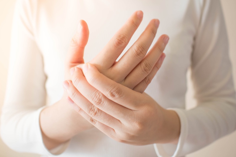 Woman Holding Hands Pain
