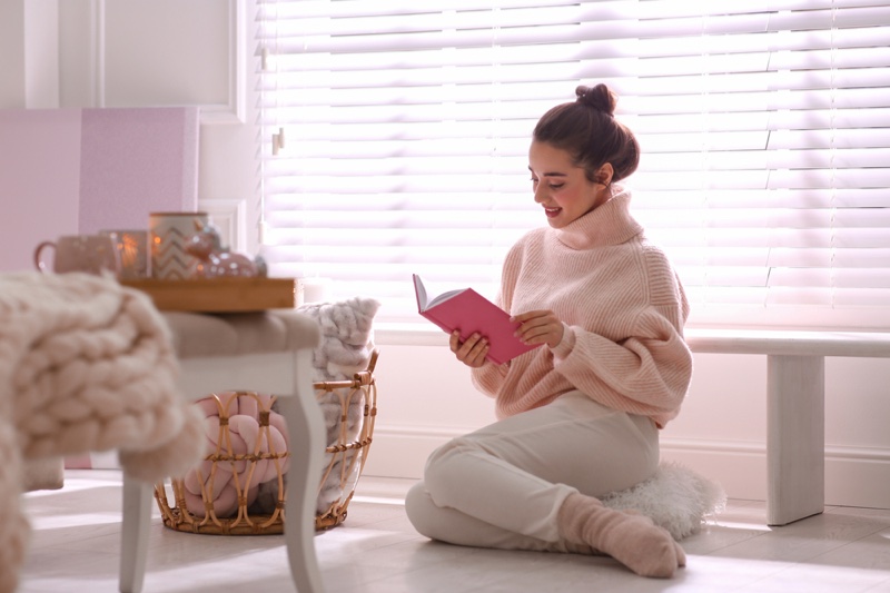Woman Home Reading Book Pink Sweater Socks Comfortable Style