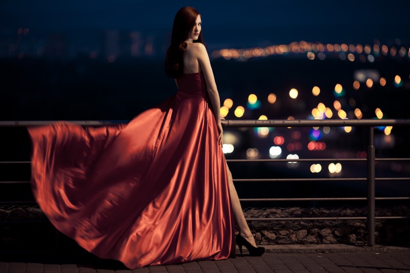 Woman Red Gown Showing Leg Slit Night