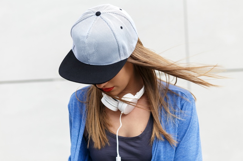 Woman Wearing Black White Baseball Cap Headphones