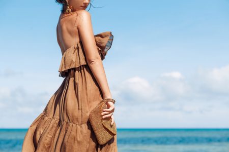 CBD is Everywhere But Should We Also Add it to Clothing? Woman Wearing Brown Dress at Beach