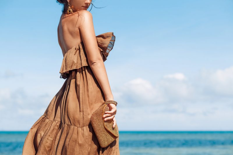 Woman Wearing Brown Dress at Beach