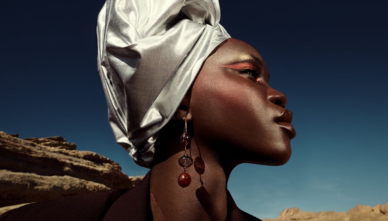 Achenrin Madit poses in Zara glass blown earrings for spring 2021 campaign.