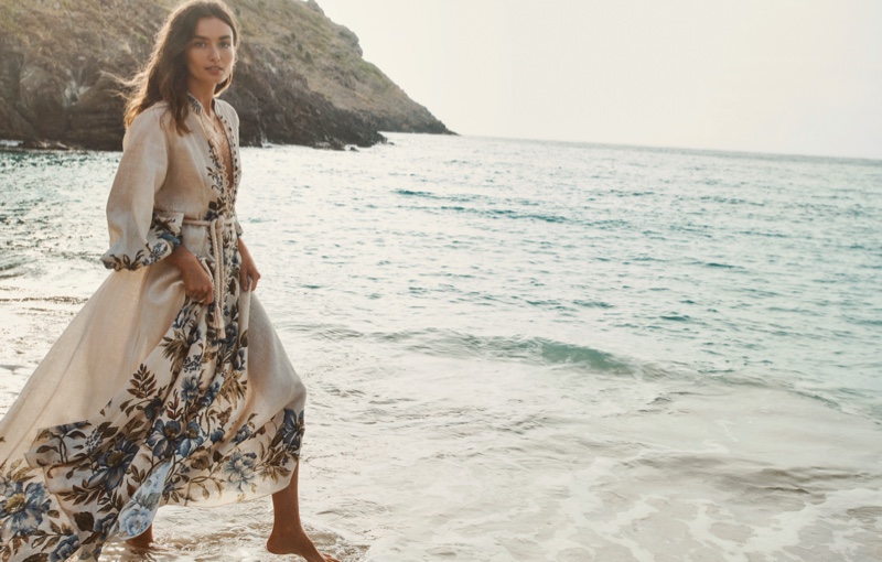 Walking on a beach, Andreea Diaconu appears in Zimmermann Swim summer 2021 campaign.