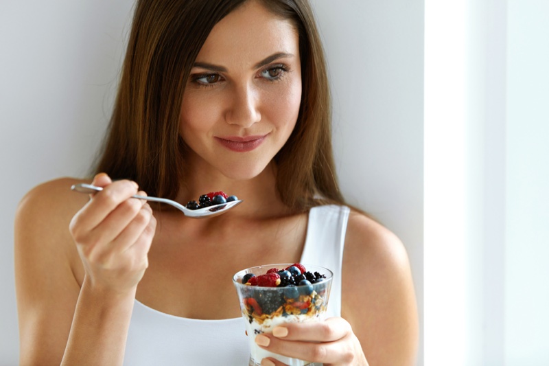 Attractive Woman Eating Berry Yogurt Food