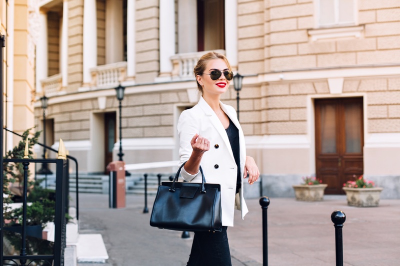 Fashionable Woman White Blazer Black Tote Bag Street