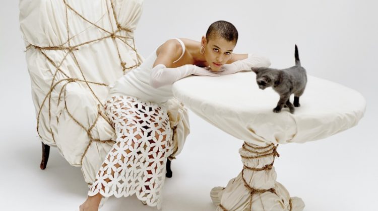 Gossip Girl star Jordan Alexander wears a Valentino dress while posing with a cat.