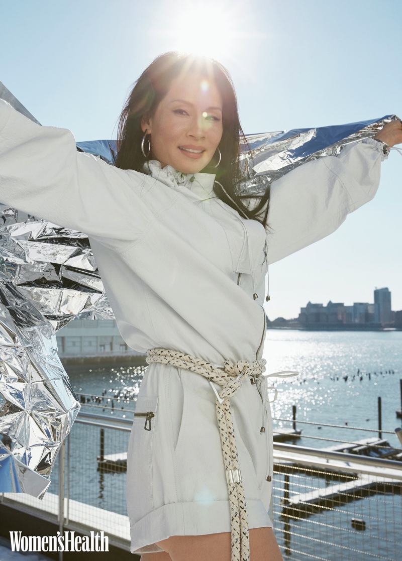 Lucy Liu wears Dodo Bar Or jumpsuit, Iro belt, and Jennifer Fisher jewelry.