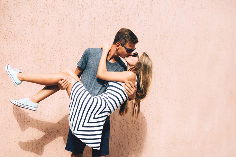 Man Holding Kissing Girlfriend Couple Young