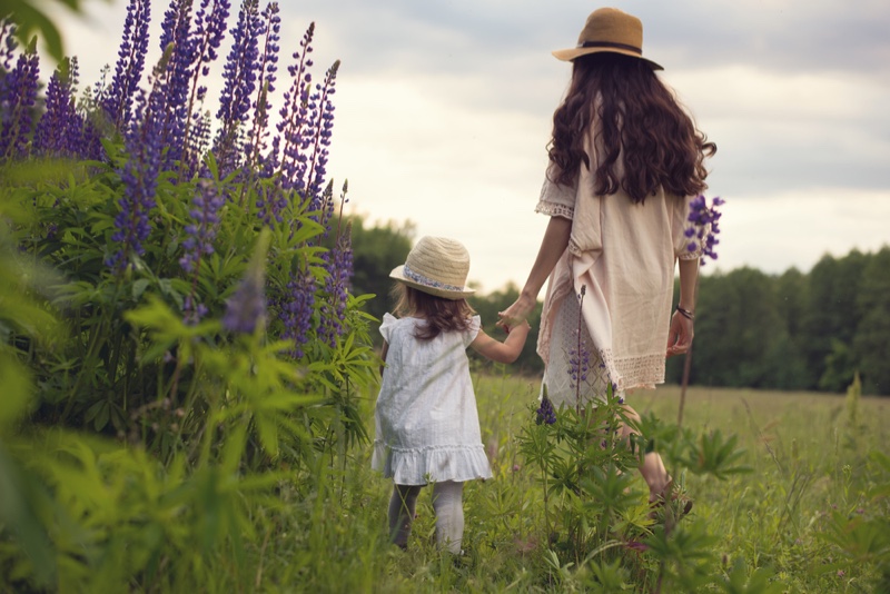 Mother Daughter Boho Style Outdoors Walking Grass