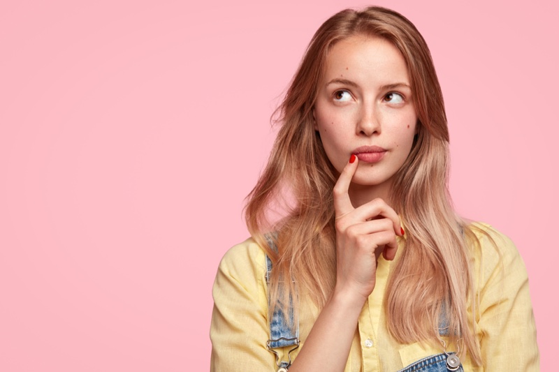 Pretty Young Blonde Woman Thinking Face