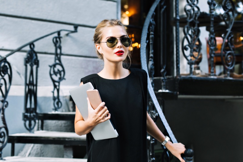 Stylish Woman Black Dress Sunglasses Holding Laptop Phone