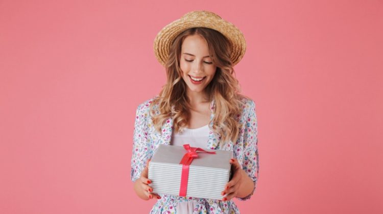 Stylish Woman Happy Holding Gift Box