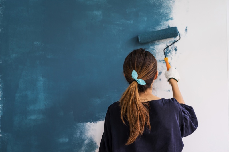 Woman Painting Wall Blue Back