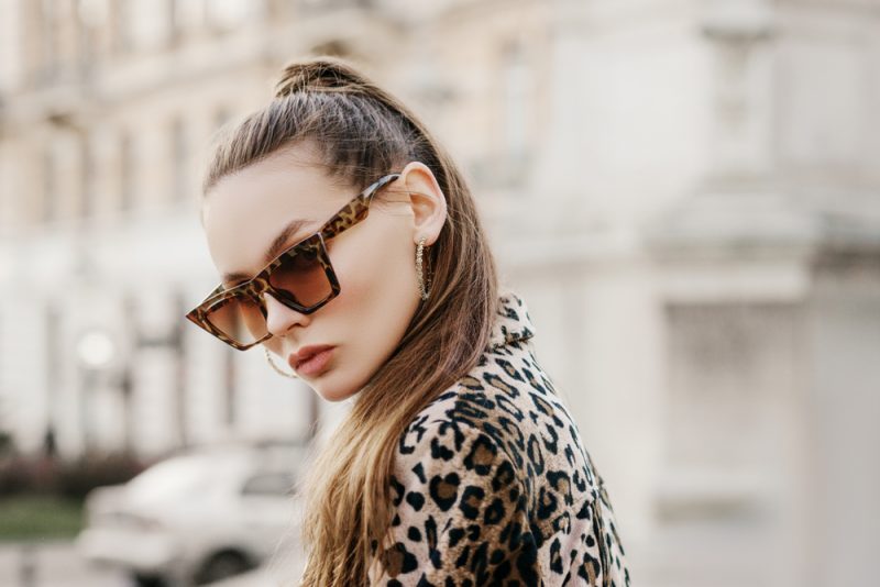 Woman in Leopard Print Sunglasses and Jacket