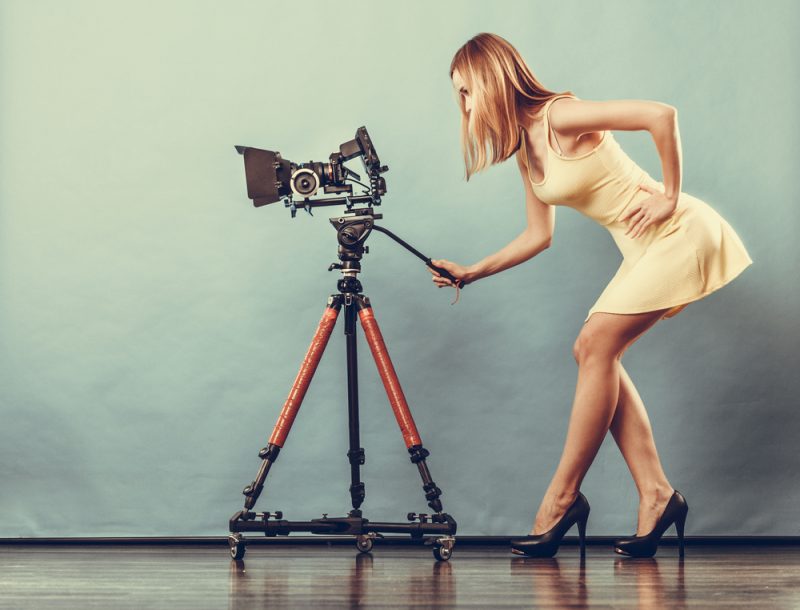 Woman with Camera in Dress and Heels